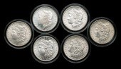 Six BU Morgan silver dollars: