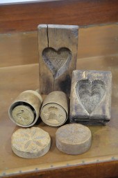 SIX BUTTER MOLDS AND STAMPS.