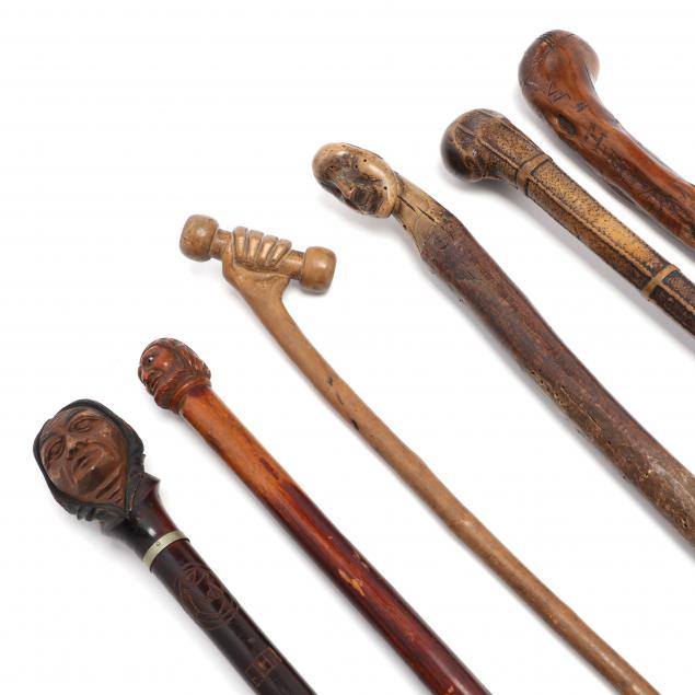 SIX CARVED FOLK ART WALKING