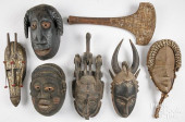 SIX CARVED TRIBAL MASKS AND WA