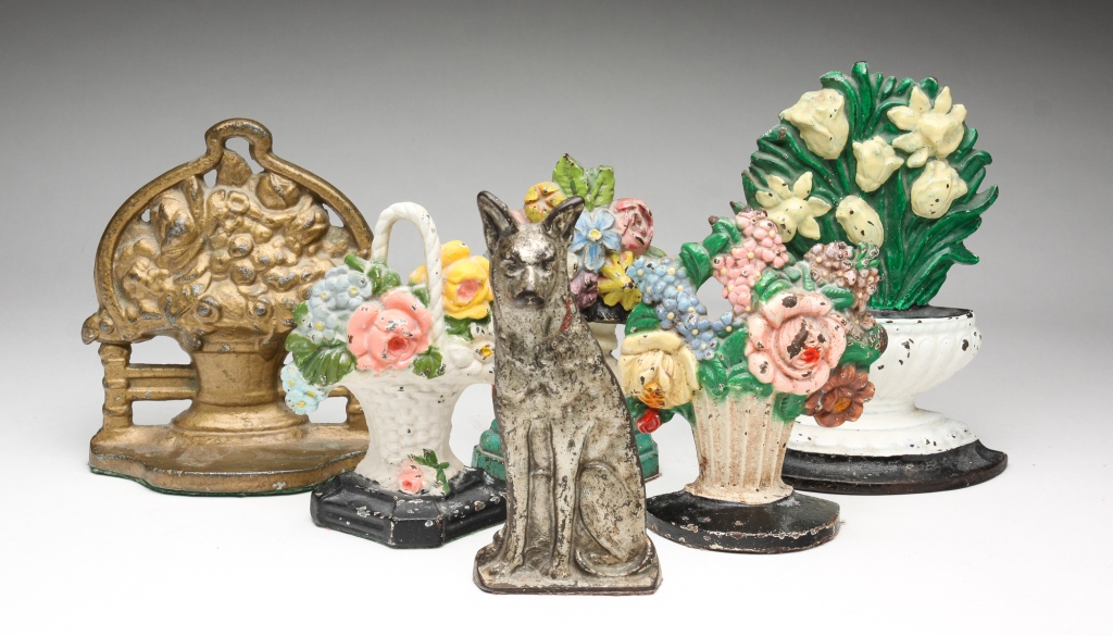 SIX CAST IRON DOORSTOPS.