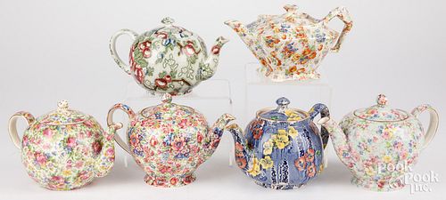 SIX CHINTZ PORCELAIN TEAPOTS,
