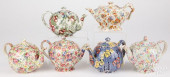 SIX CHINTZ PORCELAIN TEAPOTS,