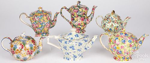 SIX CHINTZ PORCELAIN TEAPOTS,