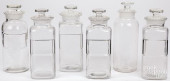 SIX COLORLESS GLASS APOTHECARY