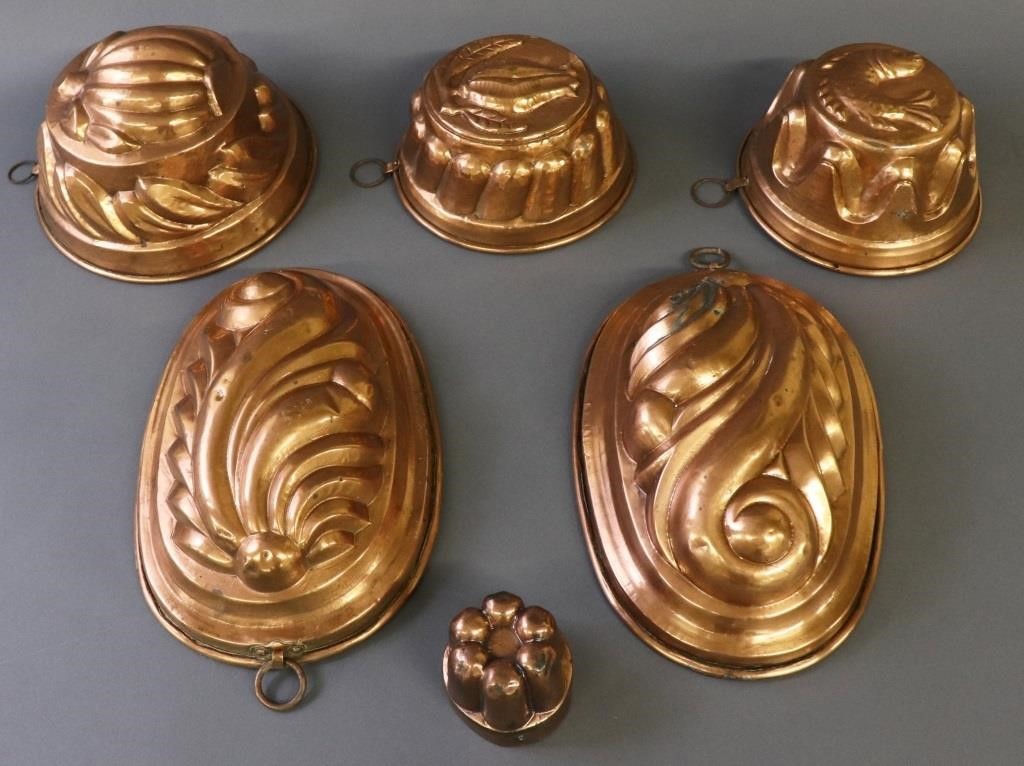 Six copper molds, all appear to