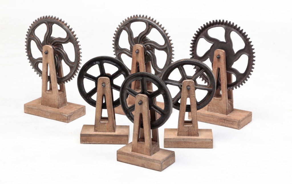 SIX DECORATIVE INDUSTRIAL GEARS.