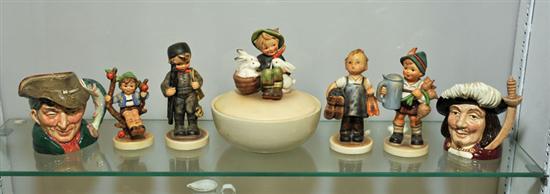 SIX FIGURINES. Including four