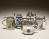 Six German decorated steins; p