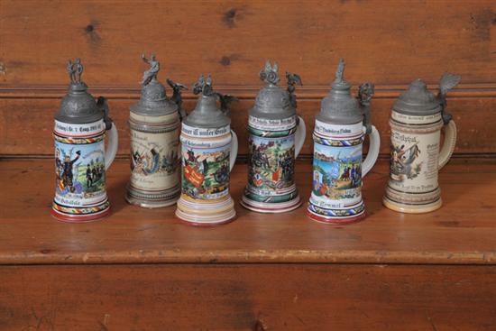 SIX GERMAN STEINS WITH PEWTER LIDS.