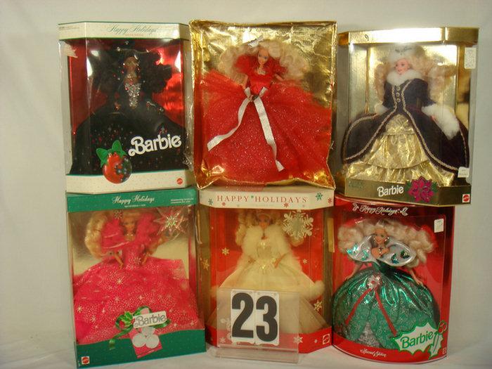 Six Holiday Barbie Dolls, all