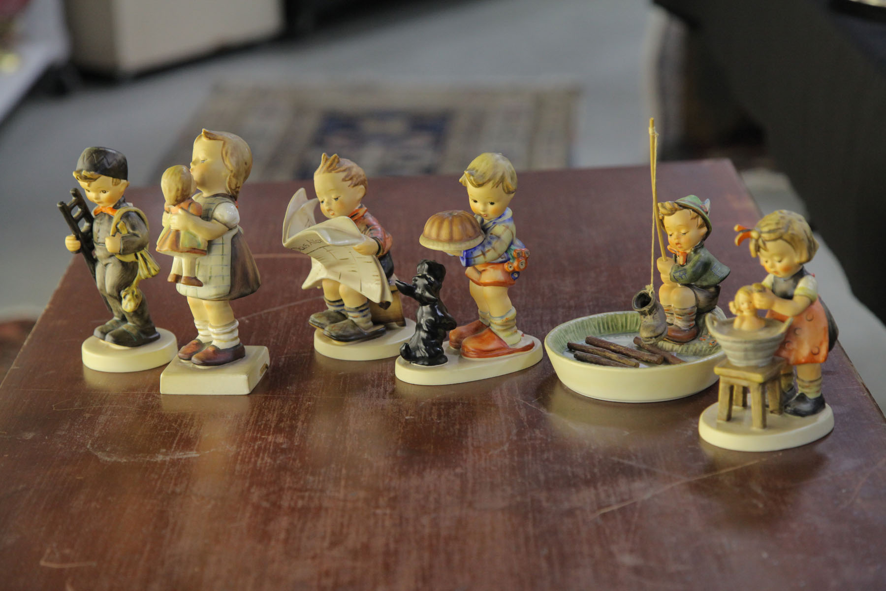 SIX HUMMEL FIGURINES.  German  20th