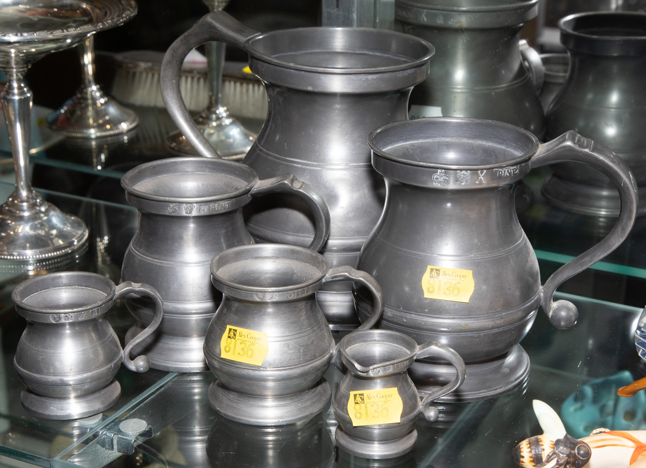 SIX PEWTER MEASURES .