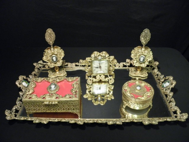 Six piece cast gilded while metal