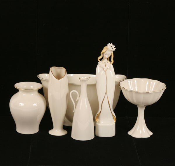 Six pieces of Lenox with gilt trim;