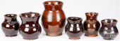SIX REDWARE PITCHERS, 19TH C.<