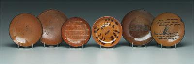 Six redware shallow bowls, all with