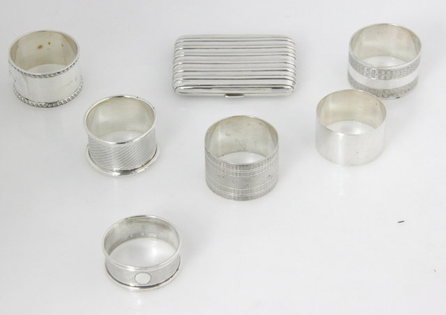 Six silver napkin rings various