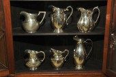 SIX STERLING PITCHERS. All mar