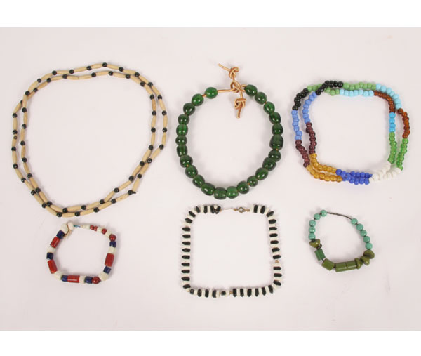 Six strands of trade beads. Green