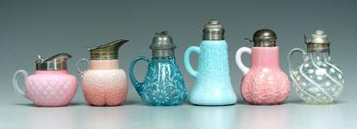 Six syrup pitchers, all with hinged