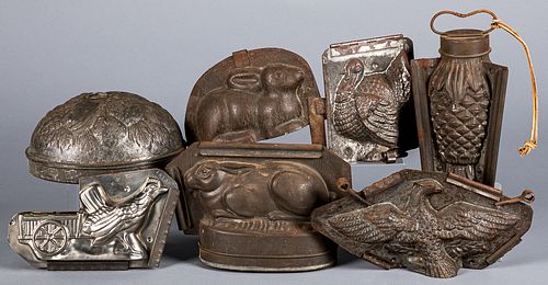 SIX TIN CHOCOLATE MOLDS AND A