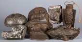 SIX TIN CHOCOLATE MOLDS AND A