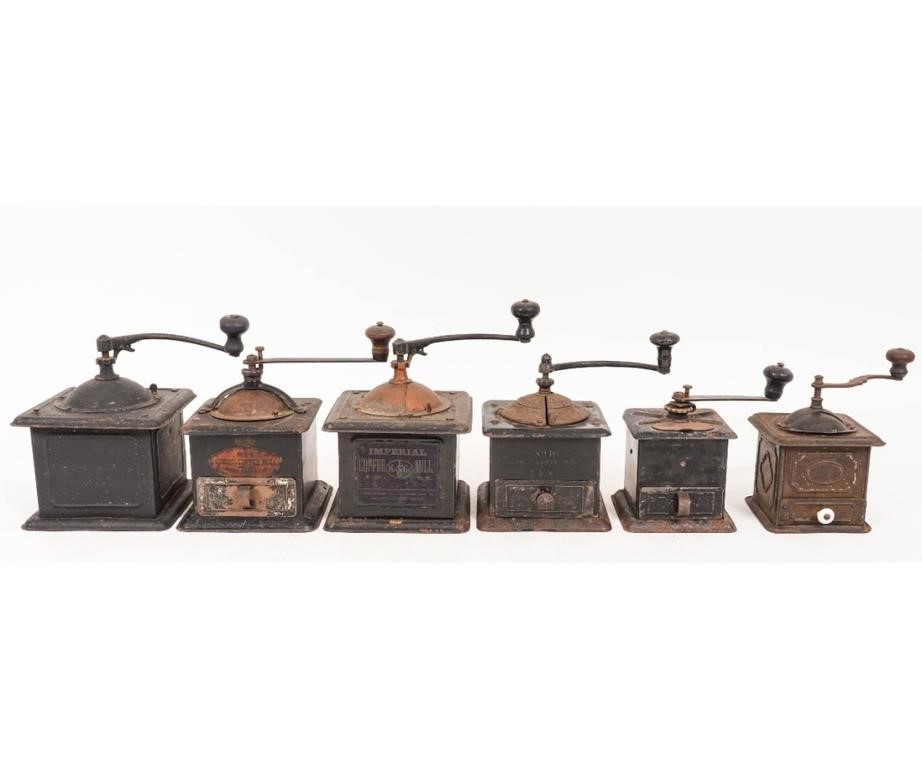 Six tin coffee mills to a