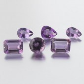 SIX UNMOUNTED 64.38 CT TOTAL M