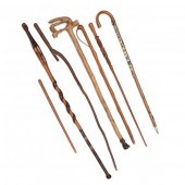 SIX VINTAGE CANES AND A CARVED