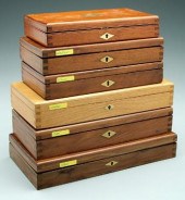 Six wooden Colt revolver cases