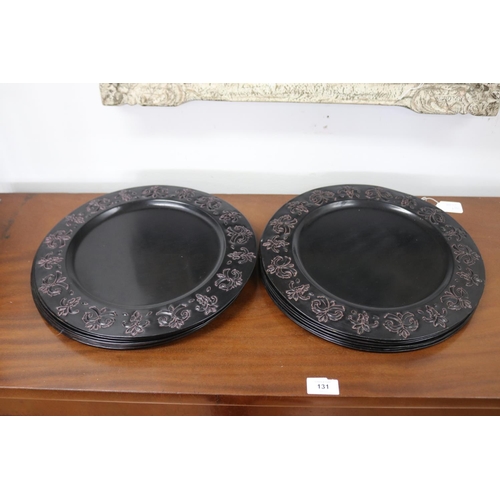 Sixteen toleware plates, each