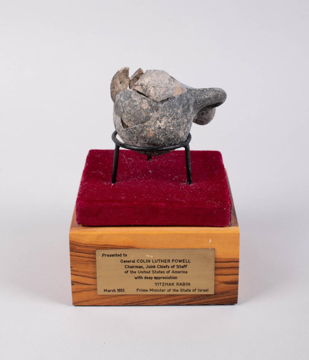 SMALL ANCIENT POT PRESENTED TO