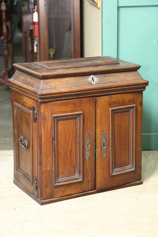 SMALL CABINET. Walnut having a