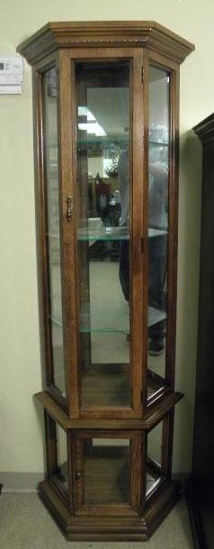 Small curio cabinet with a Walnut