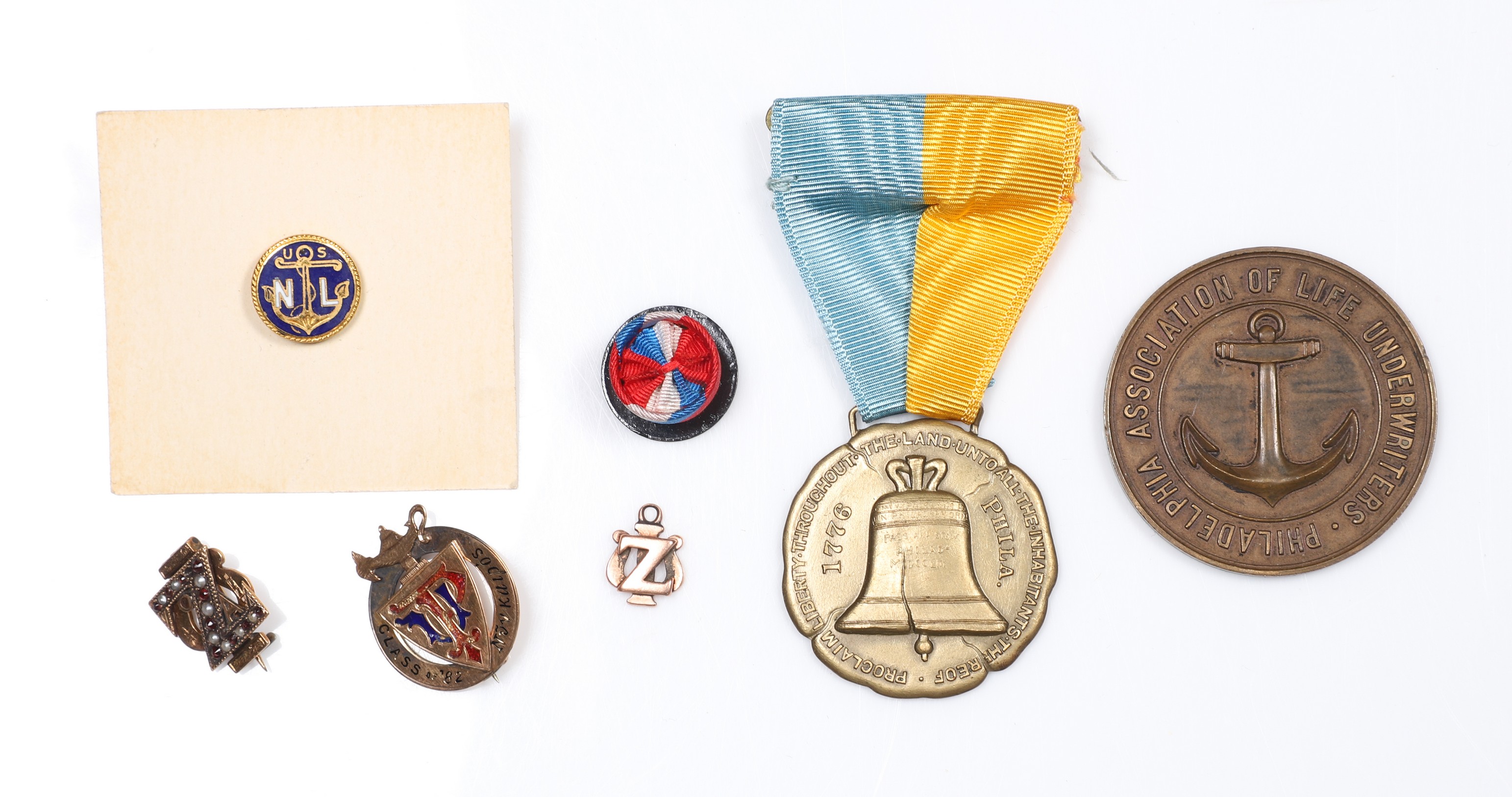Small medals and gold pins to