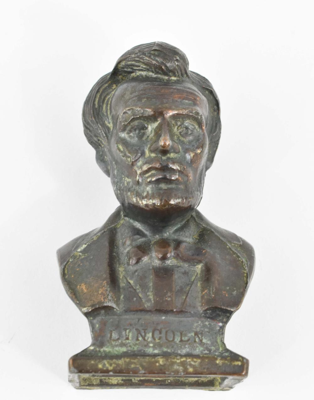 SMALL PATINATED METAL BUST OF