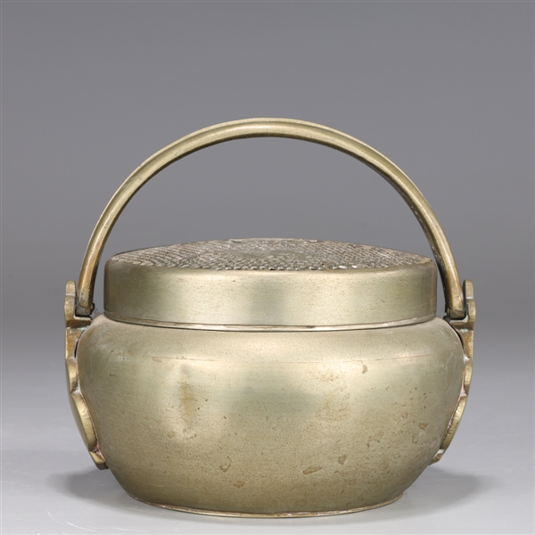 Small round Chinese bronze hand