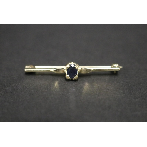 Small silver gilt brooch set with