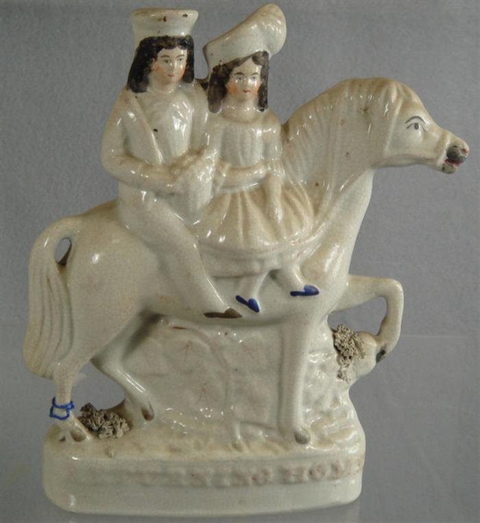 Staffordshire figurine of couple on
