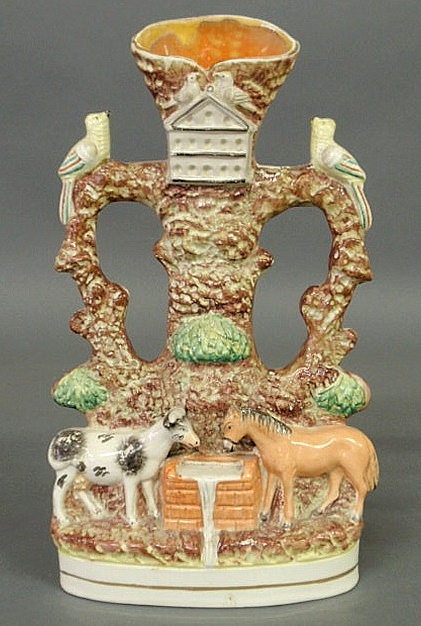 Staffordshire spill vase with a cow