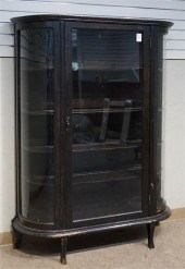 STAINED OAK BOW FRONT CURIO CA