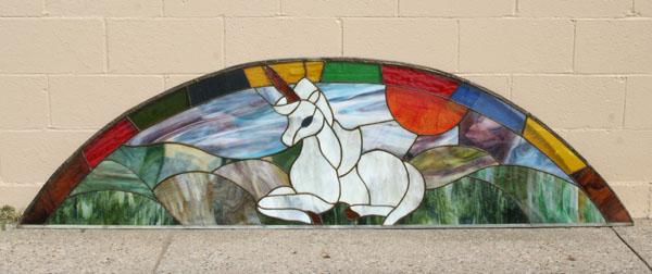 Stained slag glass arched window
