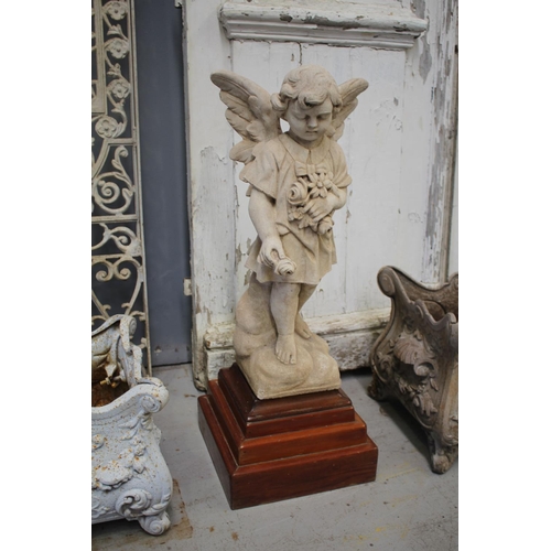 Statue angel child on wooden