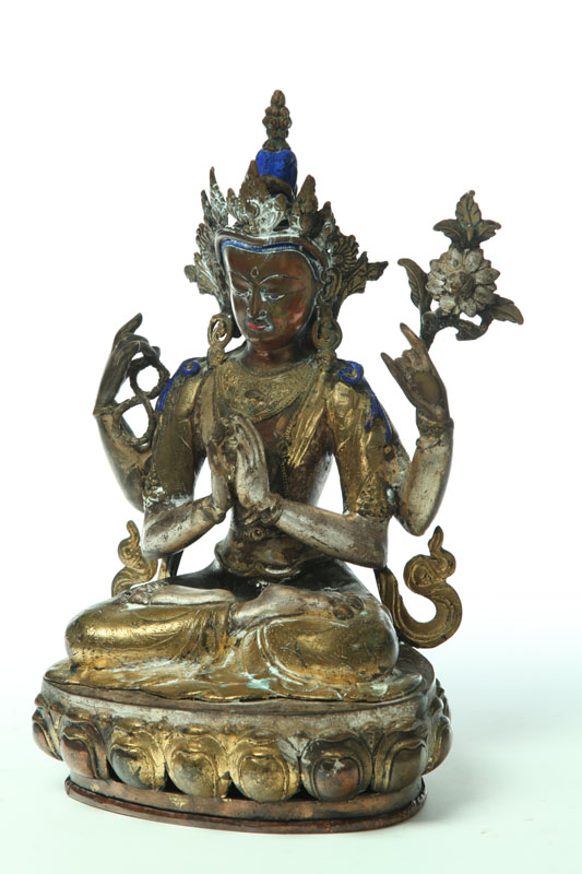 STATUE OF A FOUR-ARMED DEITY. 