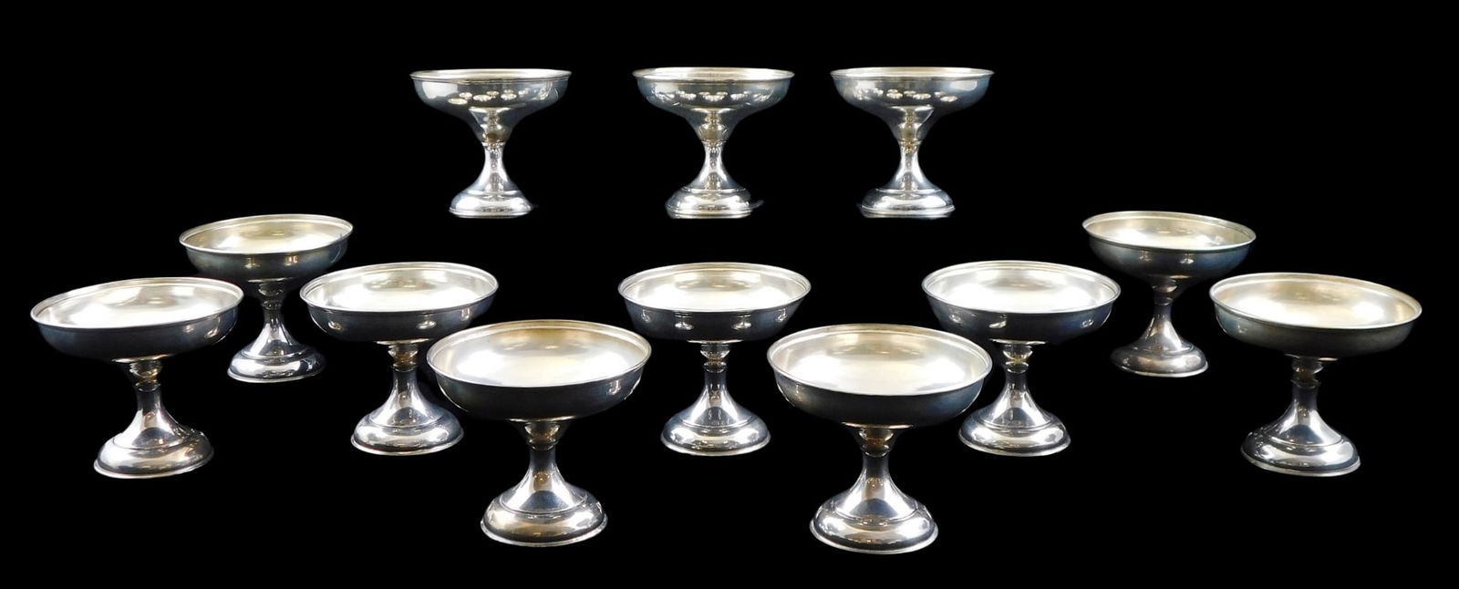 STERLING: TWELVE FOOTED CHAMPAGNE