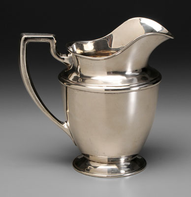 Sterling water pitcher, helmet form