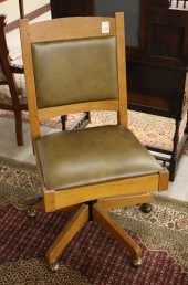 STICKLEY OAK AND LEATHER SWIVE