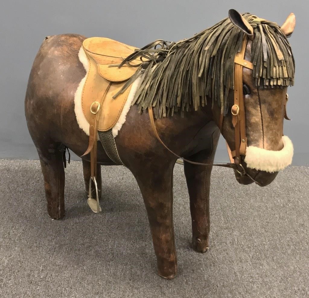 Stitched leather saddled pony,