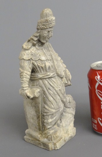 Stone carving of Scholar and